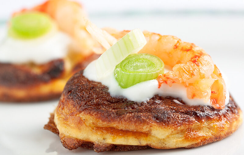 Baked egg with flour, spring onion, sour cream and crayfish.