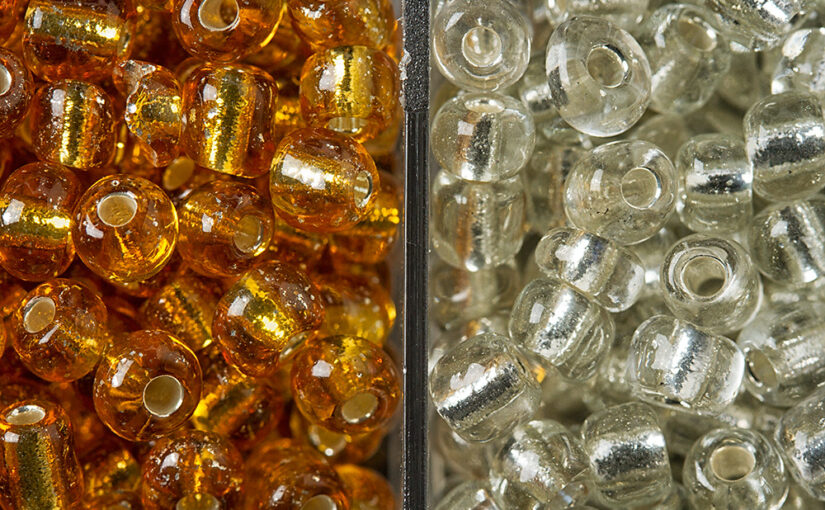 Small detail of a box with lots of beads.