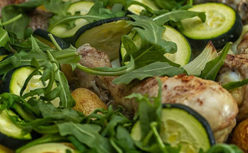 Chicken (with cinnamon), potatoes, onions and courgette, straight from the oven. Rocket added afterwards