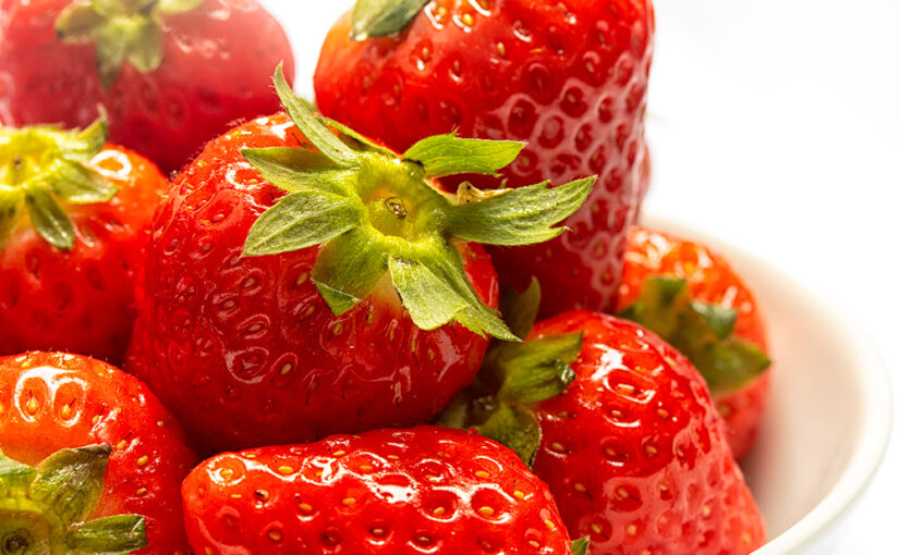 A small bowl with strawberries